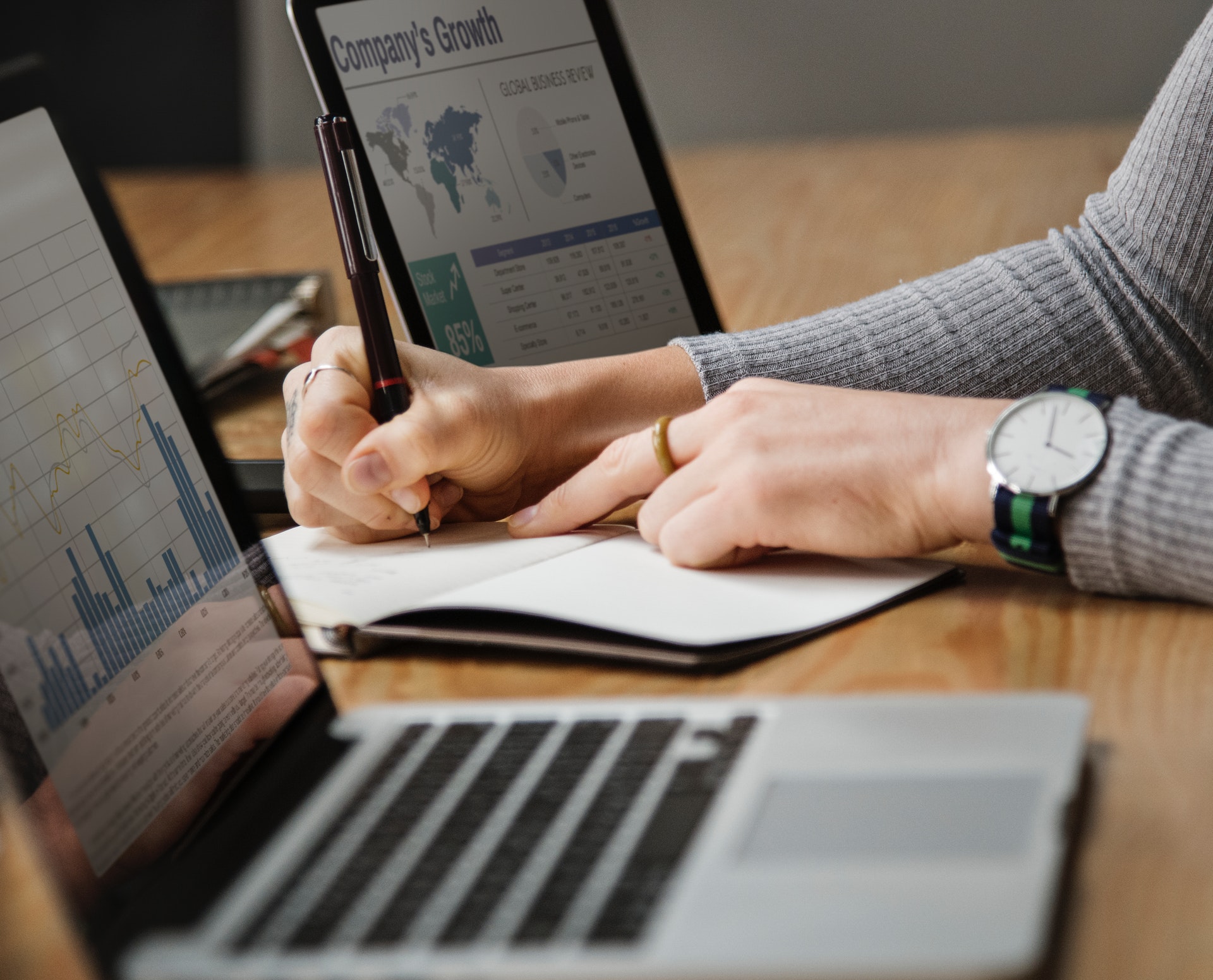 Businesswoman analyzing financial data and documents in a professional office setting