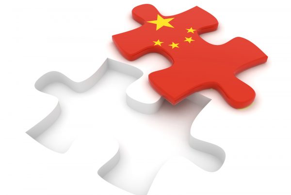 Red puzzle piece with China flag fitting into white puzzle outline